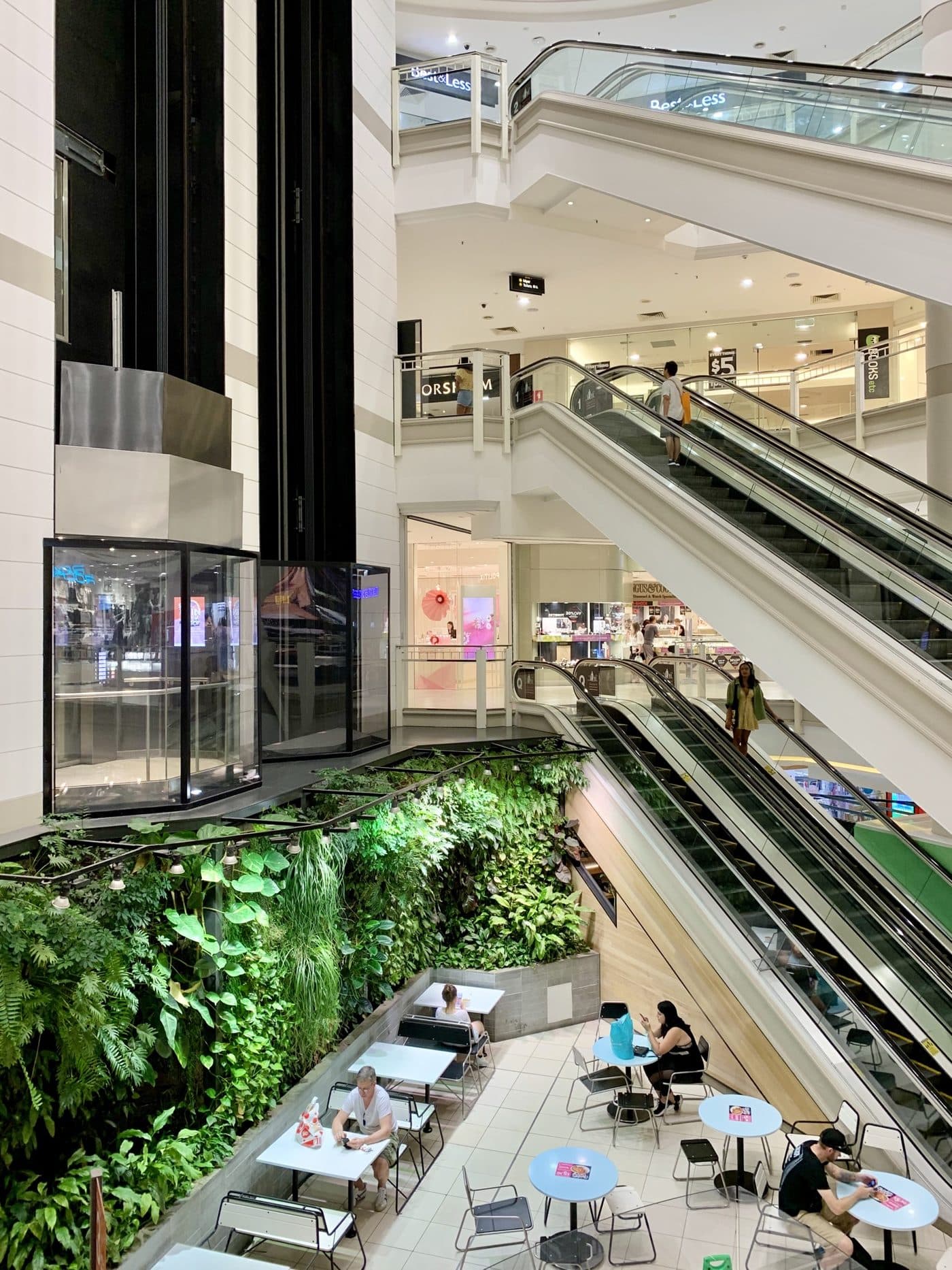 A bright atrium concourse with skylights