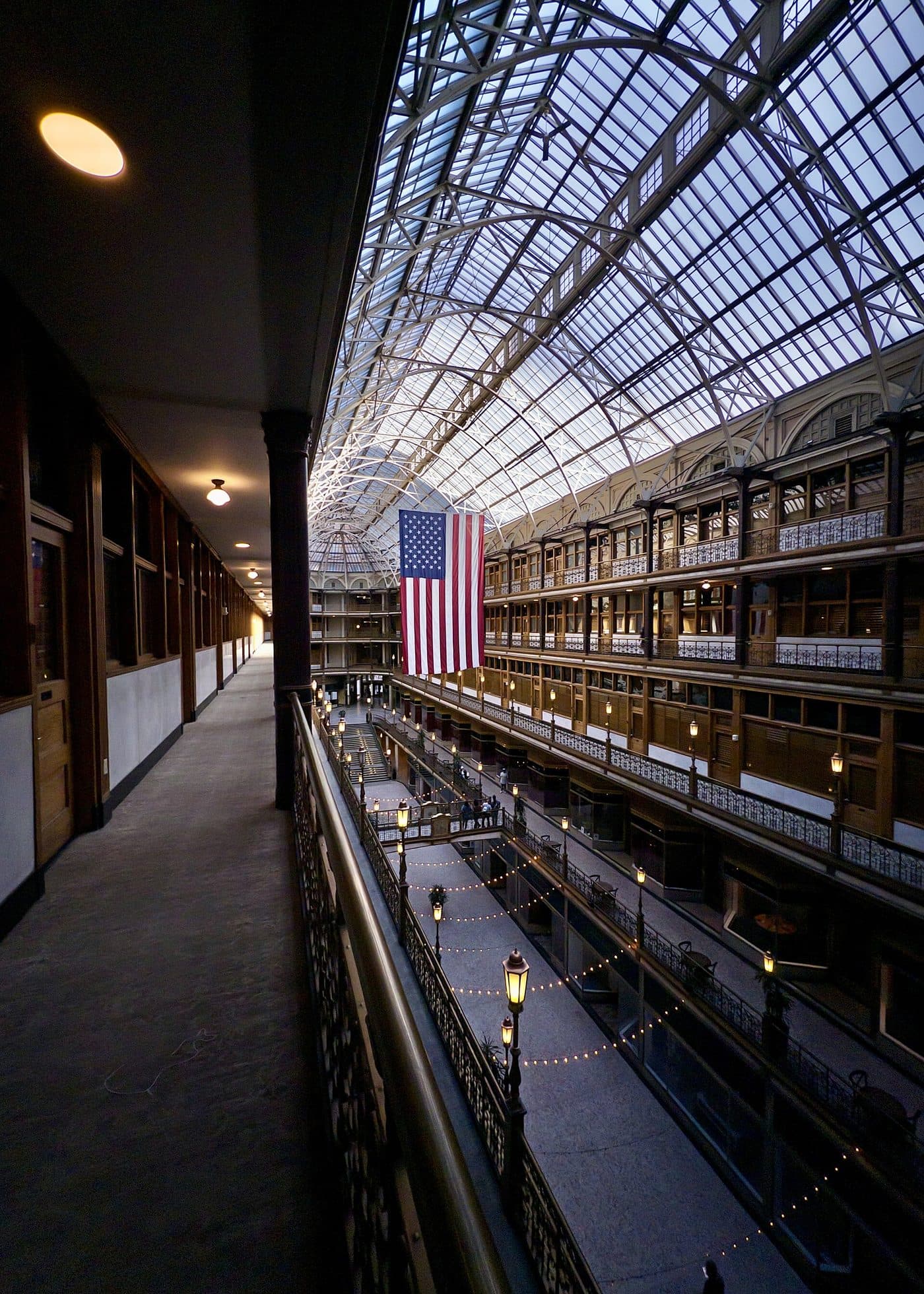An elevated interior gallery corridor overlooking an atrium